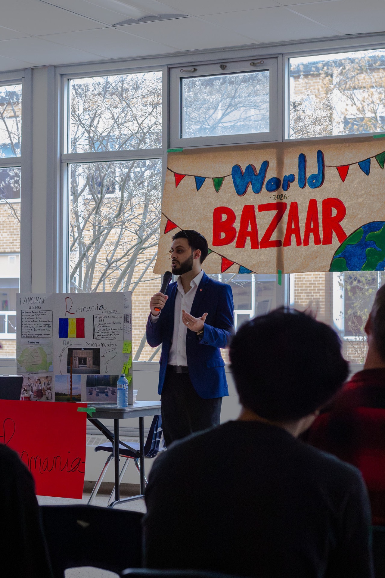Mustafa Zuberi speaking at the World Bazaar community event